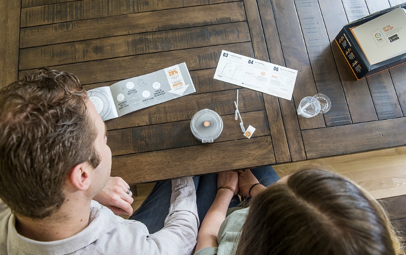 Couple Looking At Trak Fertility System